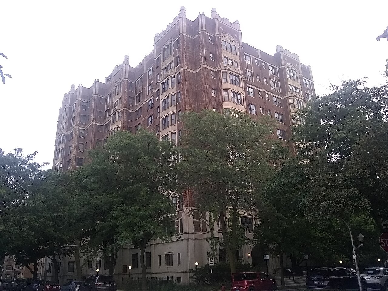 A brick cooperative apartment building on a residential block in Chicago.