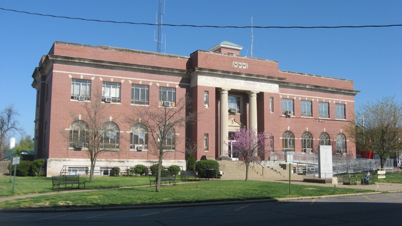 Daytime exterior view of the front and south side of the Massac County Courthouse on the public square in Metropolis, Illinois.